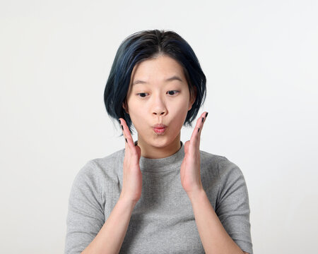 Young Attractive Asian Chinese Malay Woman Pose Face Body Expression Mode Emotion On White Background Wonder Surprised Look Down