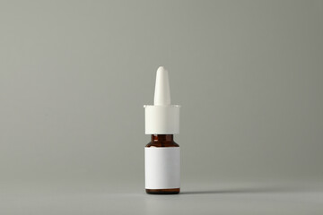 Bottle of nasal spray on light grey background