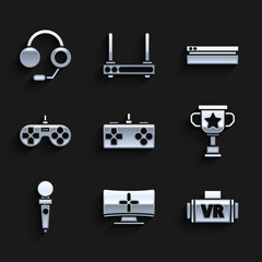 Set Gamepad, Computer monitor, Virtual reality glasses, Award cup, Joystick for arcade machine, Video game console and Headphones icon. Vector