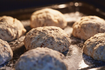 Fototapeta na wymiar Whole wheat bread with seeds. Leavening of dough. selective focus