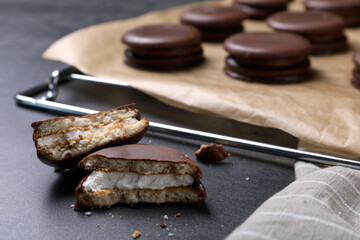 Tasty broken choco pie on grey table, closeup view © New Africa