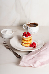 Breakfast- cheesecakes with raspberries and coffee