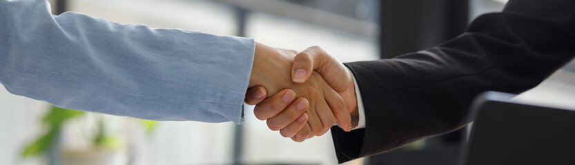 Business handshake for teamwork of business merger and acquisition,successful negotiate,hand shake,two businessman shake hand with partner to celebration partnership and business deal concept