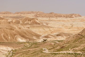 Road through hills and cliffs in the Judean Desert in Israel