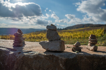 Rock Cairns on Rüdelsheim vineyards background in Autumn Milestones - High Resolution