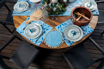 Wooden table with Christmas decorations on a terrace for Christmas dinner in Mexico