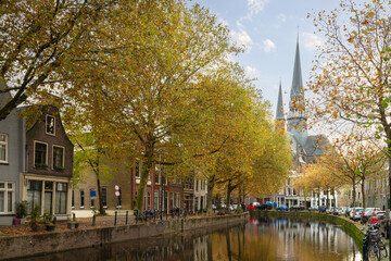 Church (Gouwekerk)  located on the Hoge Gouwe canal in the center of Gouda. - obrazy, fototapety, plakaty