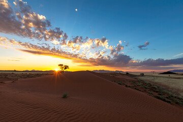 Yellow sunset and clouds at the dune in Namib Desert