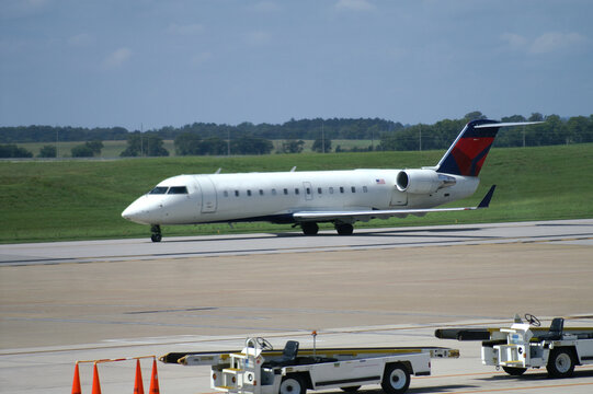 Airplane Rolling on Runway at Airport