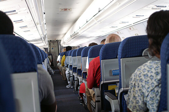 Passengers Seated  on Airplane