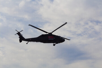 Fototapeta na wymiar Turkish police helicopter flying in the sky Sikorsky UH-60 Black Hawk