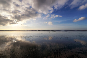 Sunrise and low tide in Cotentin coast. Annoville village 