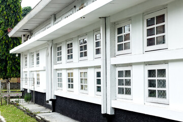 old house in vintage style with many windows.