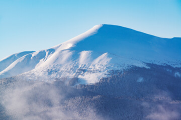 Fototapeta na wymiar Majestic mountain covered by deep snow