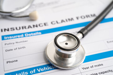 Stethoscope on Insurance  claim accident car form, Car loan, insurance and leasing time concepts.