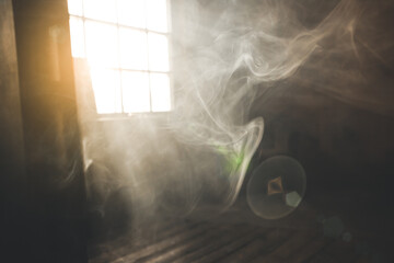 Sunshine window reflection on the wooden floor. Heavy smoke in loft design studio. Cinematic photo. © Vadym