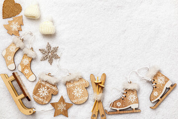 Fototapeta na wymiar Winter composition. Wooden decorations in the snow. Flat lay top view copy space.