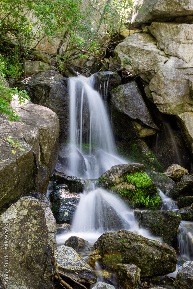 Poster Beautiful scene with a streaming waterfall in Ferguson Canyon, Utah, USA