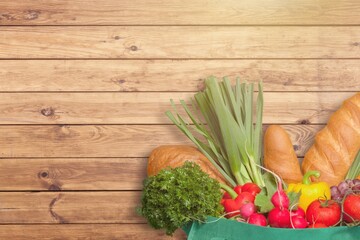 Fresh ripe vegetables in grocery paper bag