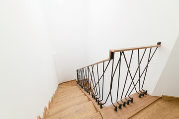 General view of the stairs in the loft style of wood and metal. Modern handmade staircase