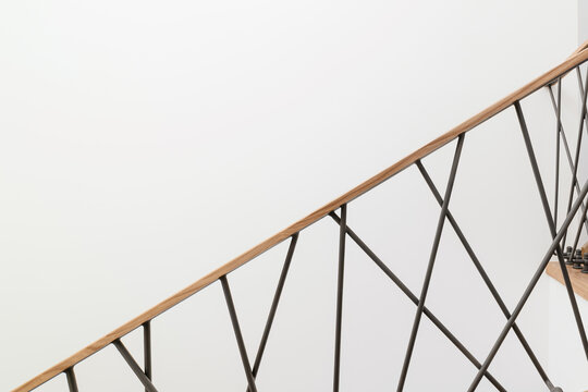 Metallic black loft-style railings with oak tree. Handmade product, White Wall