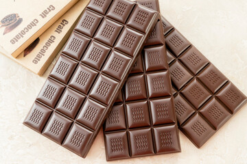 Handmade chocolate. Black bitter craft chocolate on white background. Healthy food concept,...