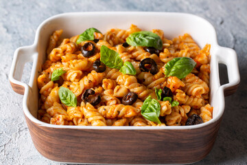 Basil leaves on pasta with arabiata sauce