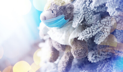 Toy bear in mask to prevent virus spread. Copy space. Teddy bears wearing protective mask. Coronavirus protection.