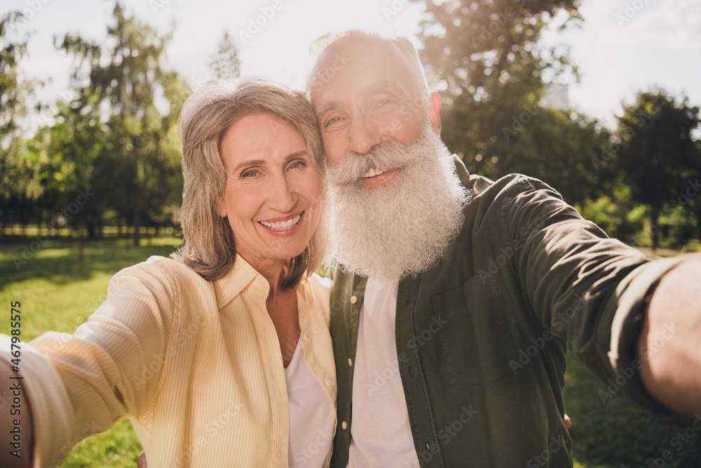 Sticker photo of old joyful retired pensioner people couple make selfie enjoy summer day outside outdoors in