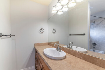 Bathroom interior with vanity sink and towel bar holder
