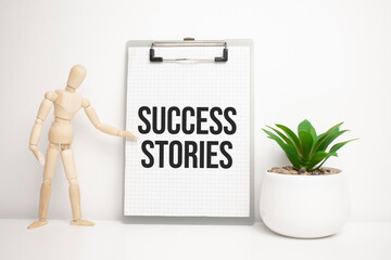 success stories sign on small wood board rest on the easel with medical stethoscope