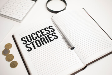 Business accessories, calculator, coins, reports and magnifier glass with text success stories