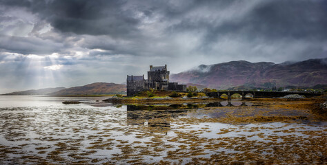 Panorama of the famous Eilean Donan Castle on a wet and foggy autumn day in Scotland