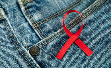 jeans with red ribbon, World Aids Day, Healthcare and medical concept.