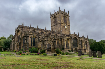 Fototapeta na wymiar A Photograph of an Ancient, Aged Church in Sheffield, England, With dramatic clouds.