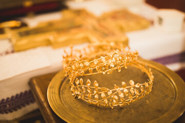 Golden crowns lying on the table in church