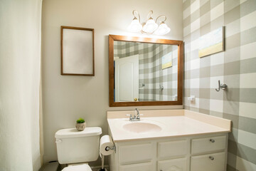 Fototapeta na wymiar Small bathroom interior with checkered wallpaper on the right