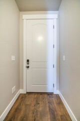 White fire door with a digital access to the garage