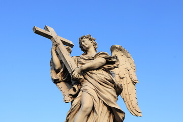Angel With the Cross Statue Detail on the Ponte Sant'Angelo Bridge in Rome, Italy