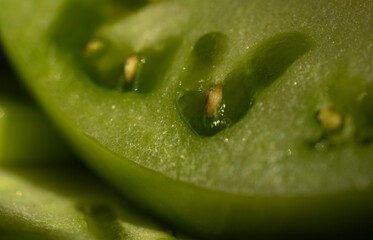 Close up view of a green tomato seed.