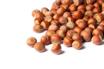 Shelled hazelnuts on the white background