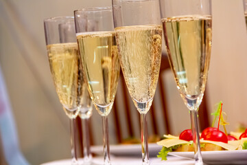 A home party. Champagne glasses are on the table.