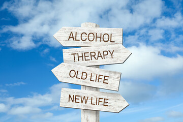 Alcohol addiction: what to choose - therapy or life with bad habit? Wooden signpost with different...