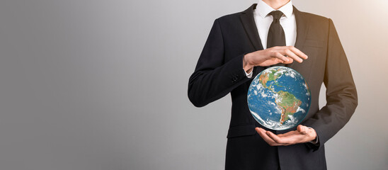 3D Earth planet globe in man, woman hand, hands on blue background. Environmental protection...