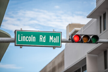 Miami Beach famous Lincoln Road mall in South Beach street with closeup of sign text in green and red traffic light