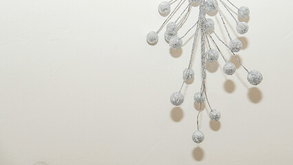 creative inverted Christmas tree made of silver berries and branches,