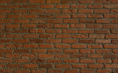 Background texture of red-brown brick wall. Copy space for text