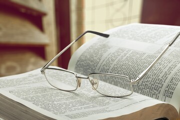 A Jewish Torah textbook on a Synagogue indoor background.