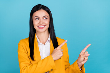 Photo of dreamy inspired young business lady point fingers empty space idea cool isolated on blue color background