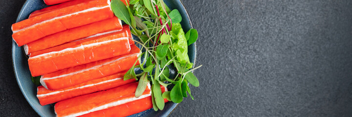 crab stick surimi seafood crab meat semi-finished meal snack on the table copy space food background rustic  © Alesia Berlezova